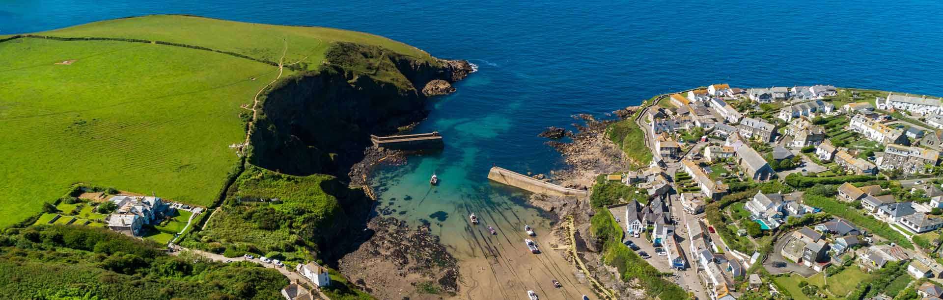 Aerial view of touring and caravan pitches in the countryside at Atlantic Bays Holiday Park, St Merryn near Padstow