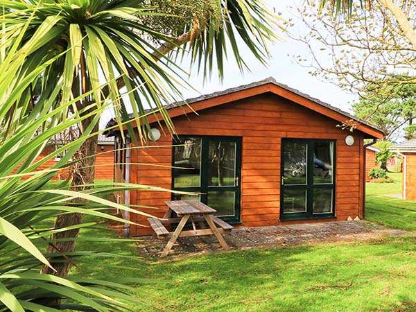Bright, comfortable Deluxe Sun Cabin interior at Atlantic Bays Holiday Park near Padstow