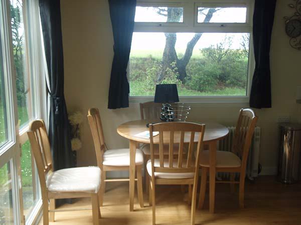 Deluxe Sun Cabin kitchen and dining space at Atlantic Bays Holiday Park