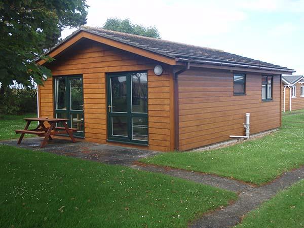Twin bedroom inside a Deluxe Sun Cabin at Atlantic Bays, St Merryn