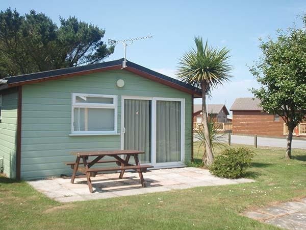 Sun Cabin chalet interior with open-plan living space at Atlantic Bays, Padstow