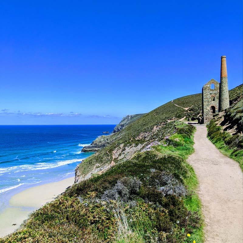 Walkers on the South West Coast Path along the North Cornwall coastline near Padstow